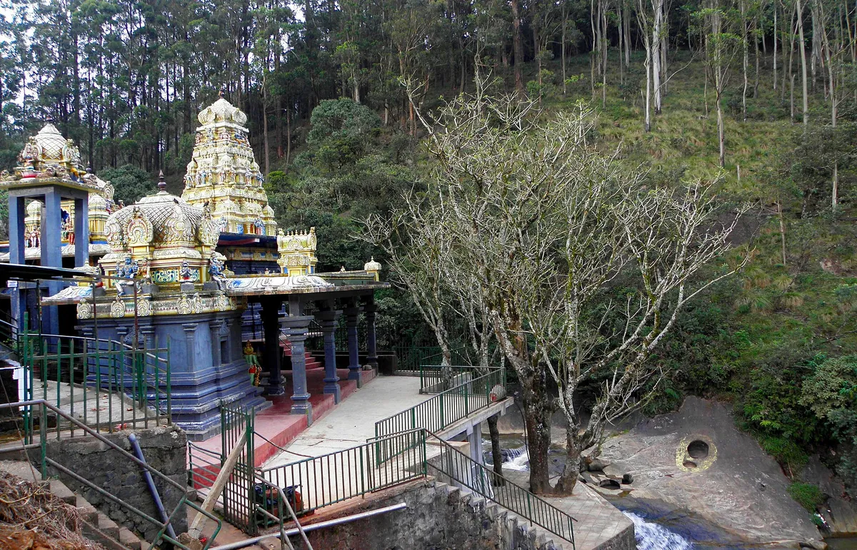 The Seetha Amman Temple at Seetha Eliya, set among trees beside a stream near Nuwara Eliya